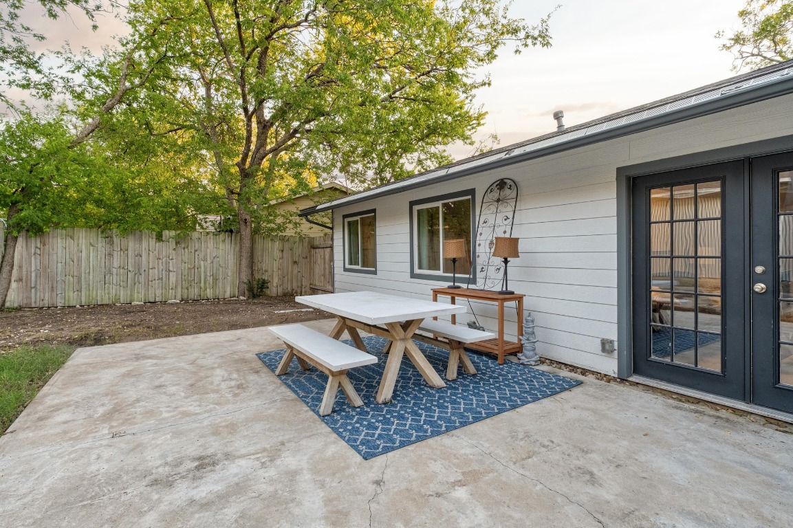 5307 Halmark Drive Austin, TX 78723 - Photo 30 of 31 a backyard of a house with table and chairs