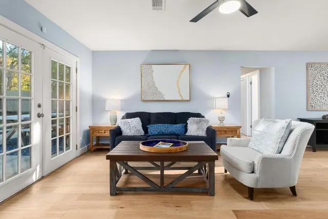 a living room with furniture and a rug