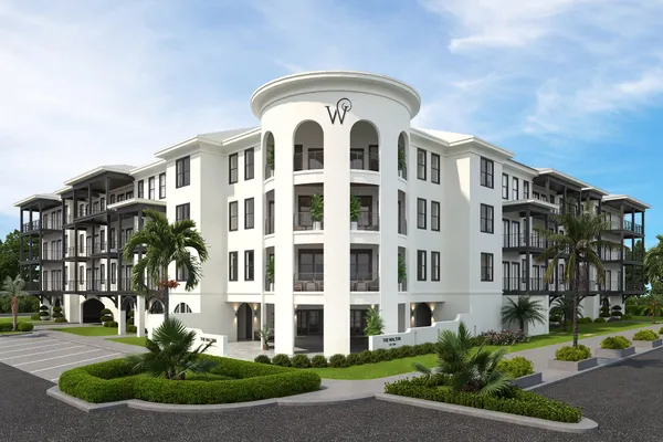 a front view of a building with garden