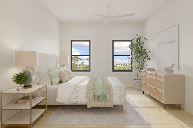 a spacious bedroom with a bed and a window