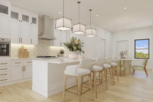 a kitchen with stainless steel appliances granite countertop a table and chairs in it