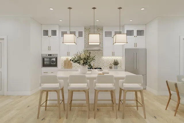 a dining hall with stainless steel appliances kitchen island granite countertop a table and chairs