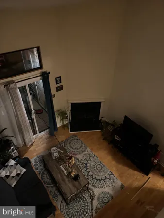 a bedroom with a bed and a television