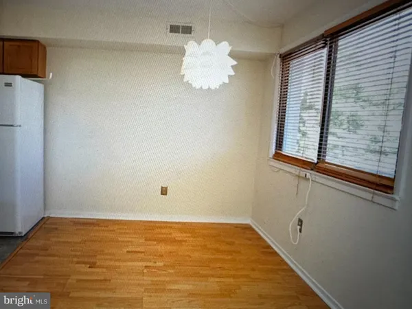 a view of a room with wooden floor and stairs