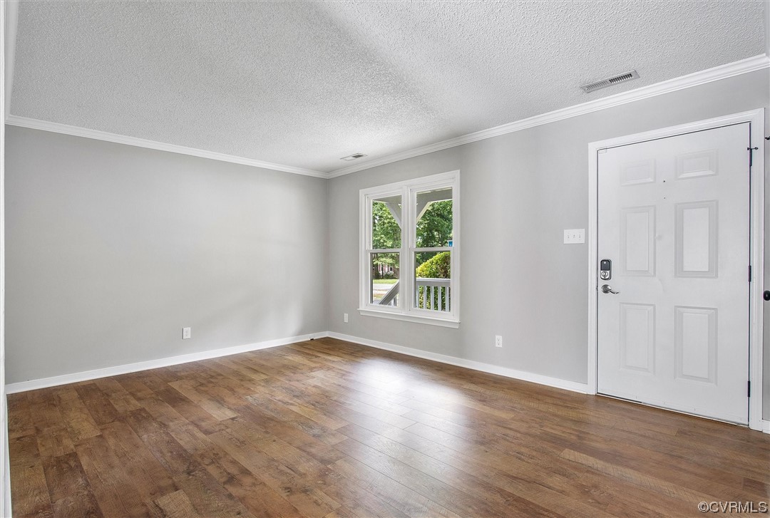 4647 Brookridge Road Chesterfield, VA 23832 - Photo 6 of 28 a view of an empty room with wooden floor and a window