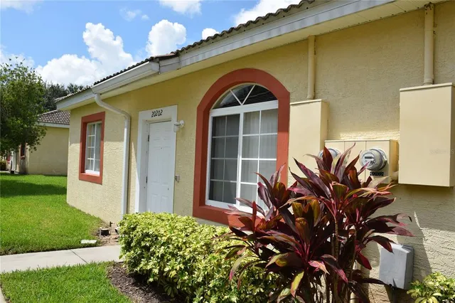a view of a house with a flower garden