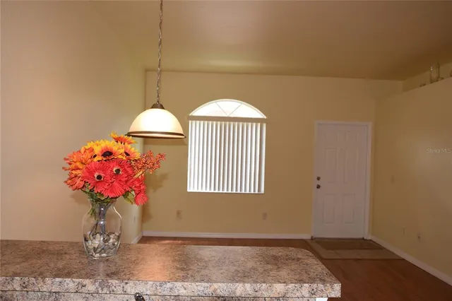 a bathroom with a sink mirror and window