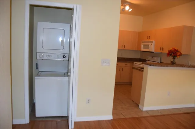 a view of a kitchen from the hallway
