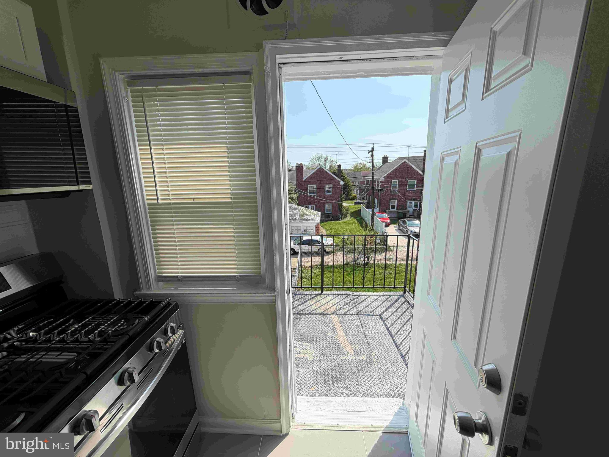 1535 East Cold Spring Lane Baltimore, MD 21218 - Photo 20 of 24 a kitchen with a stove and a window