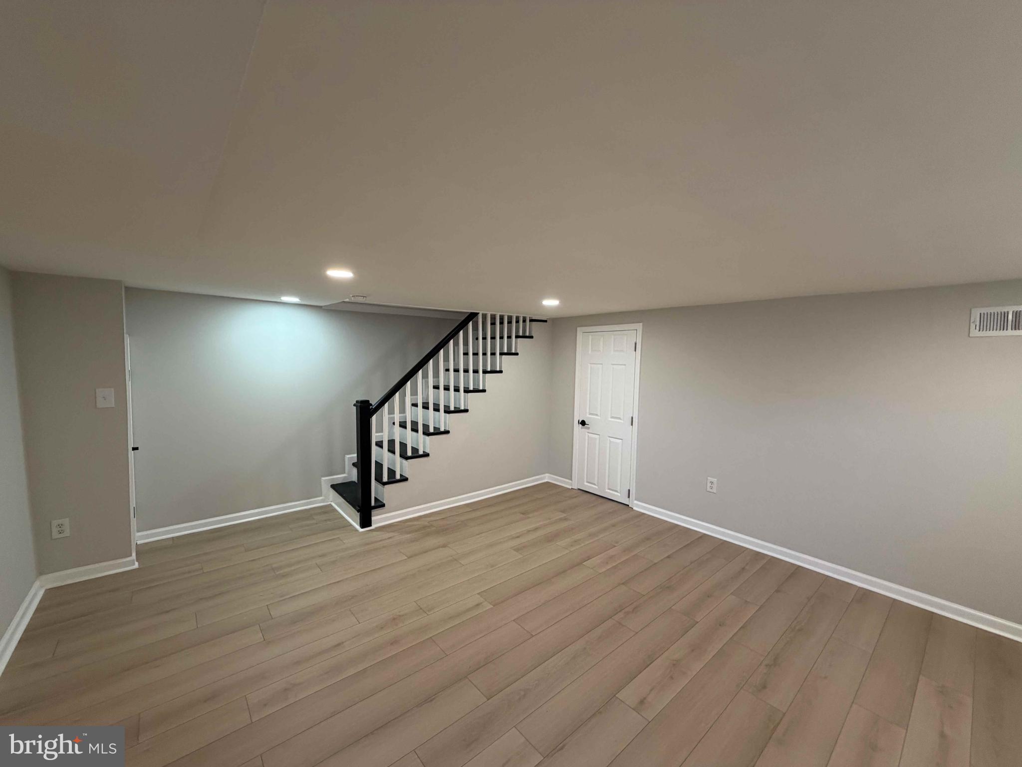 1535 East Cold Spring Lane Baltimore, MD 21218 - Photo 23 of 24 a view of an empty room with stairs
