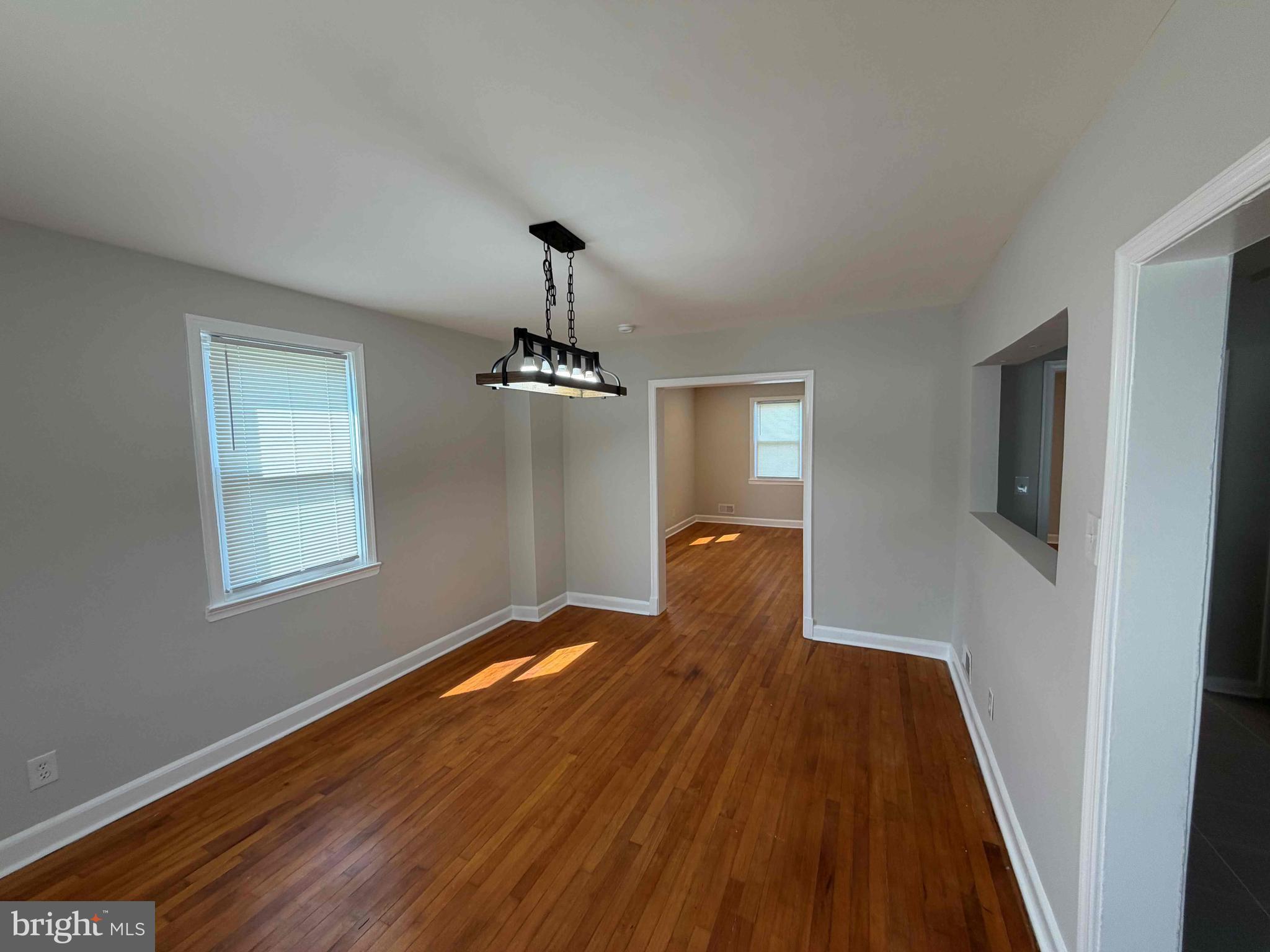 1535 East Cold Spring Lane Baltimore, MD 21218 - Photo 6 of 24 a view of empty room with wooden floor