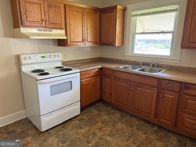 135 Fairview Street Hartwell, GA 30643 - Photo 4 of 14 a kitchen with sink cabinets and window