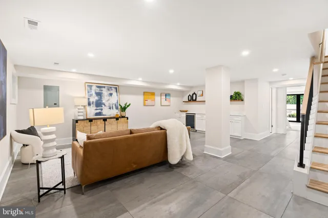 a bedroom with a large bed and a large window