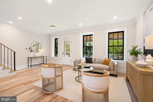 a view of a dining room with furniture wooden floor and a chandelier