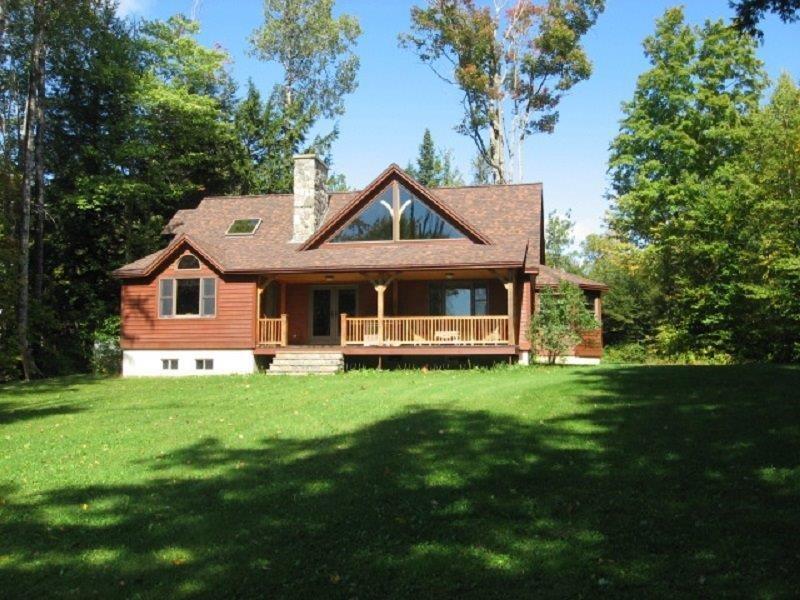 492 W Road Sangerville, ME 04479 - Photo 3 of 33 Front of home with lawn to water