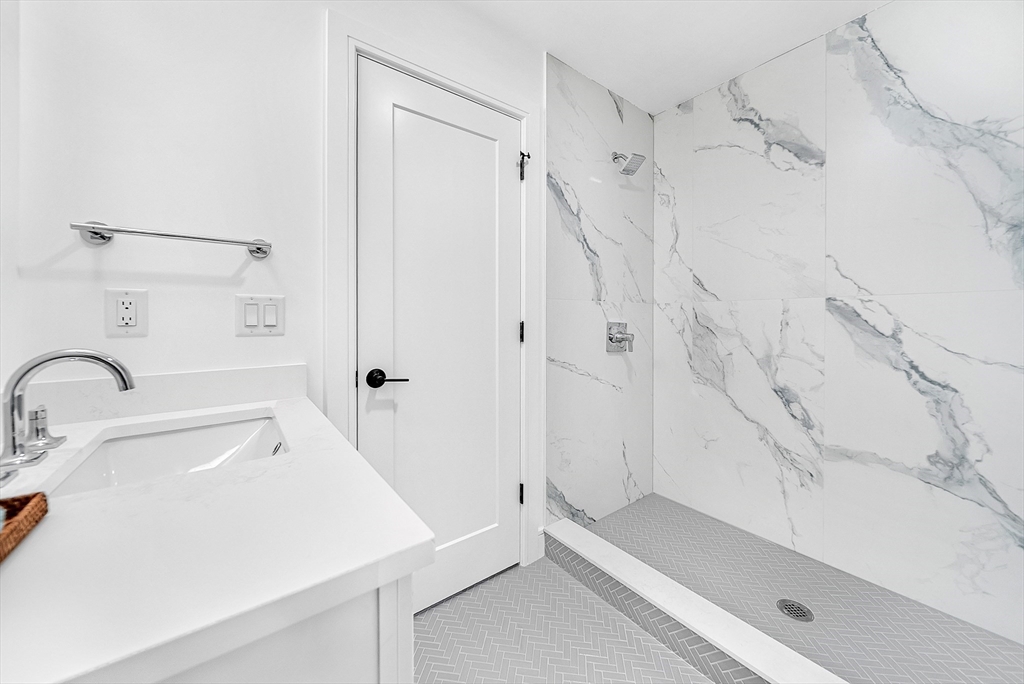 29 Irving Road Natick, MA 01760 - Photo 25 of 42 a bathroom with a sink and a shower
