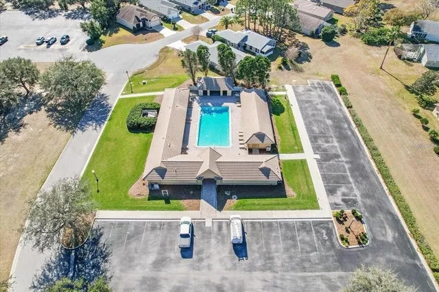 an aerial view of a house with a swimming pool