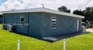 a backyard of a house with lots of green space