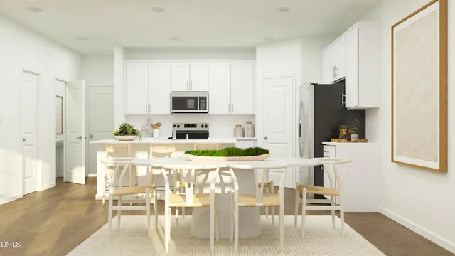 a kitchen with stainless steel appliances kitchen island granite countertop a refrigerator and a stove top oven