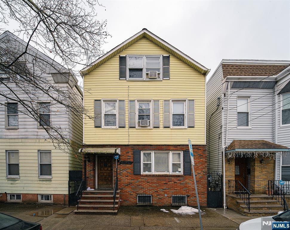 390 Lafayette Street Newark, NJ 07105 - Photo 1 of 40 a front view of a house
