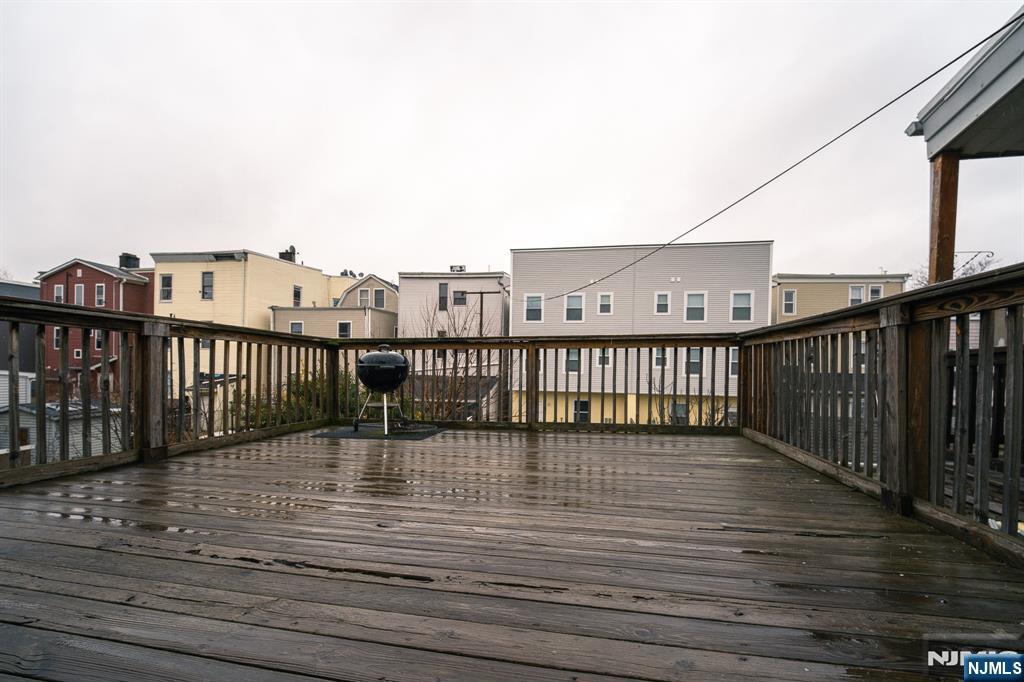 390 Lafayette Street Newark, NJ 07105 - Photo 22 of 40 a view of balcony with wooden floor