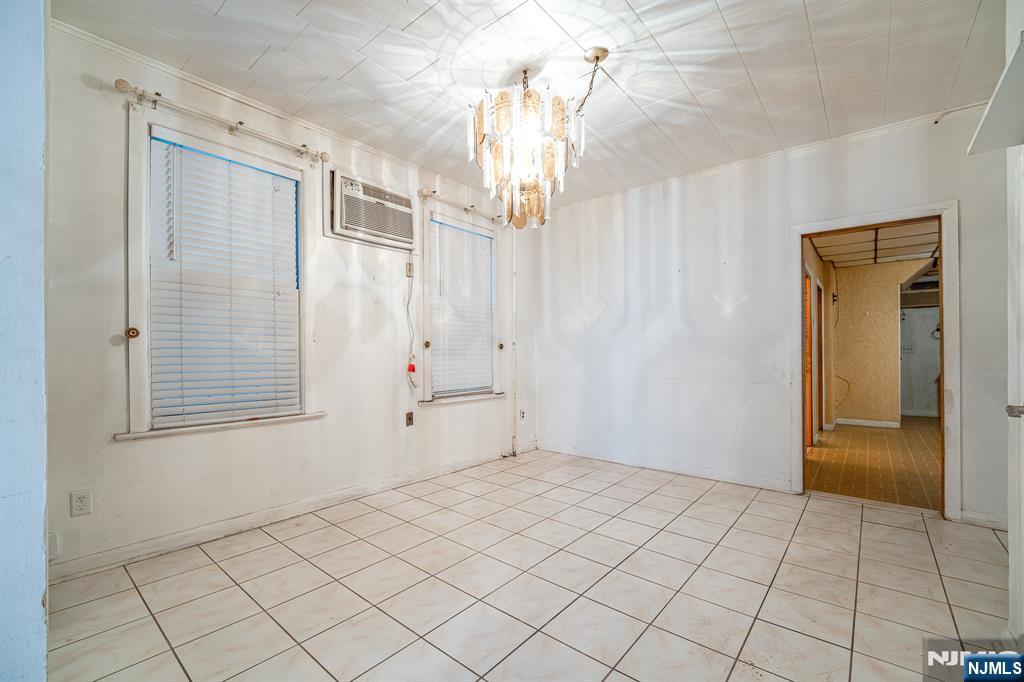 390 Lafayette Street Newark, NJ 07105 - Photo 5 of 40 a view of an empty room with a window