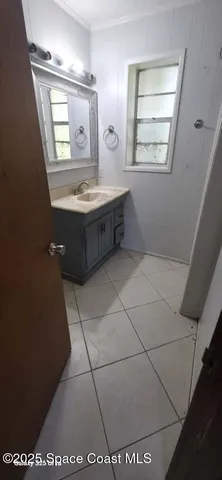 a bathroom with a mirror and a sink