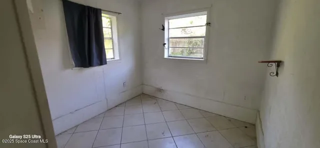 an empty room with windows