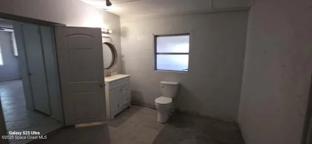 a bathroom with a toilet and a sink