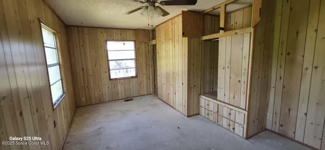 a view of a hallway with windows