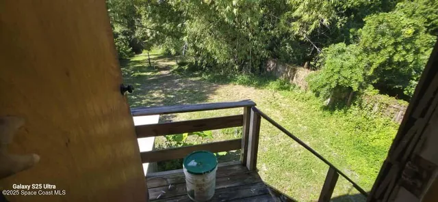 a backyard of a house with lots of green space