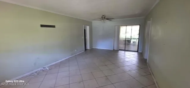 a view of an empty room and window