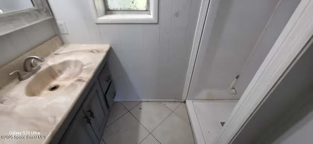 a bathroom with a sink and washing machine
