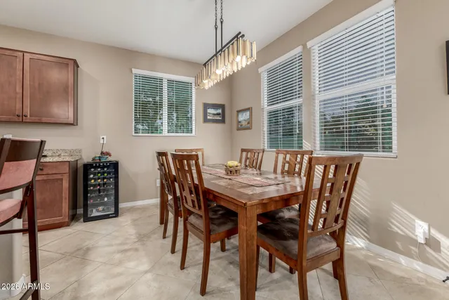 a view of a dining room with furniture and window