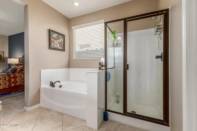 a bathroom with a tub and shower