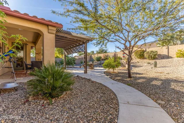 a view of a yard with a tree