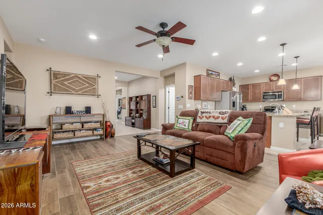 a living room with furniture and kitchen view