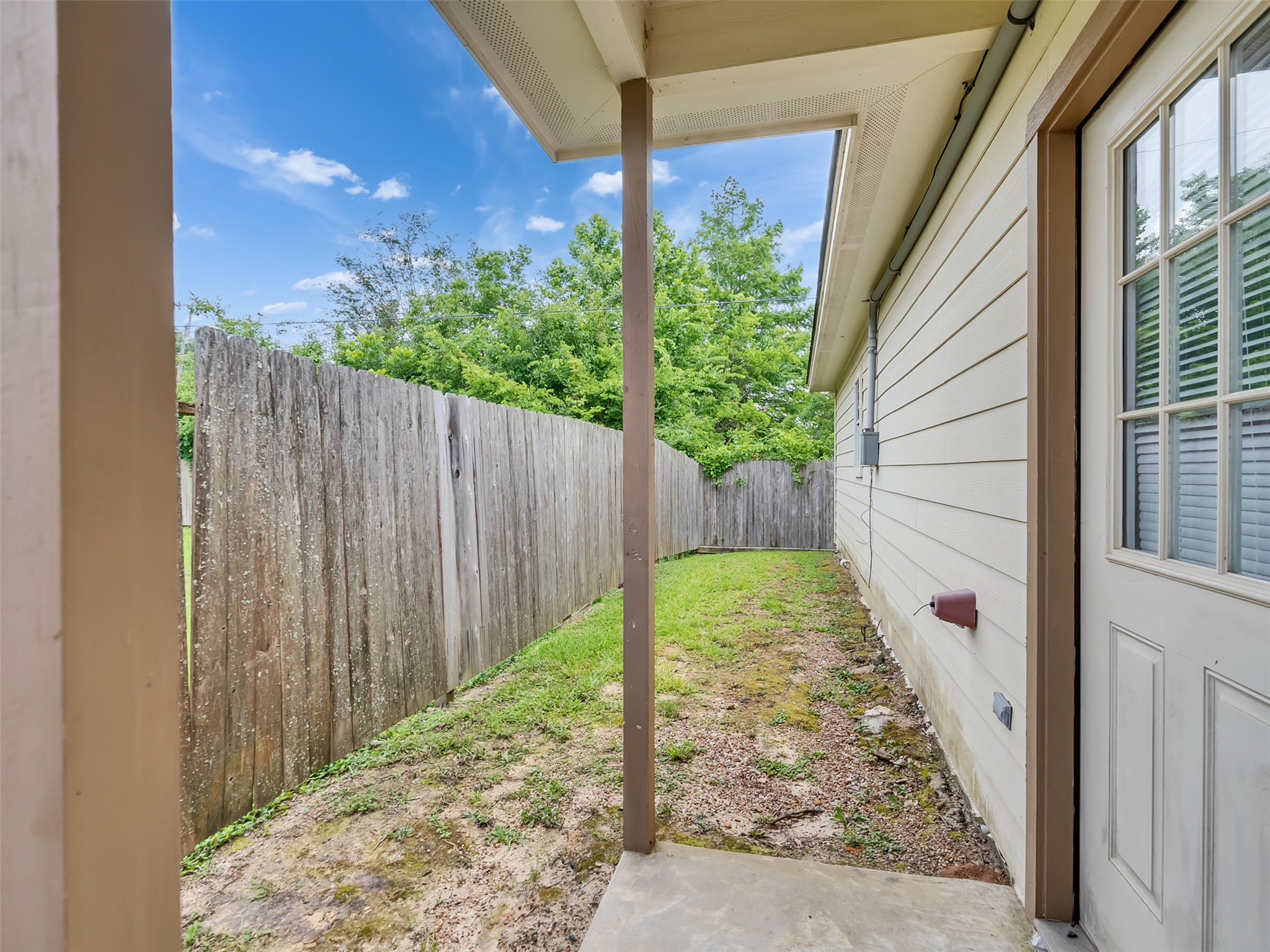104 Longstreet Road, Unit 2 Willis, TX 77378 - Photo 23 of 26 a view of a backyard with pathway