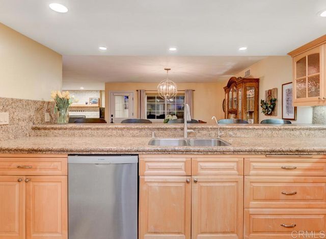 a kitchen with granite countertop cabinets and a sink