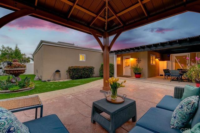 a front view of a house with patio