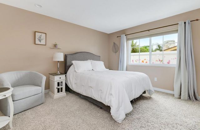 a bed room with a bed and a couch