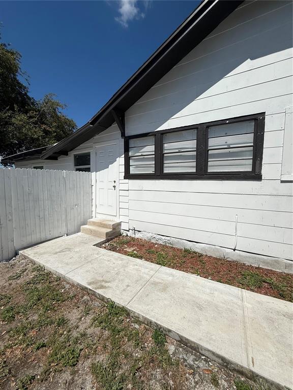 3124 West Ivy Street, Unit B Tampa, FL 33607 - Photo 1 of 1 a front view of a house with a garage