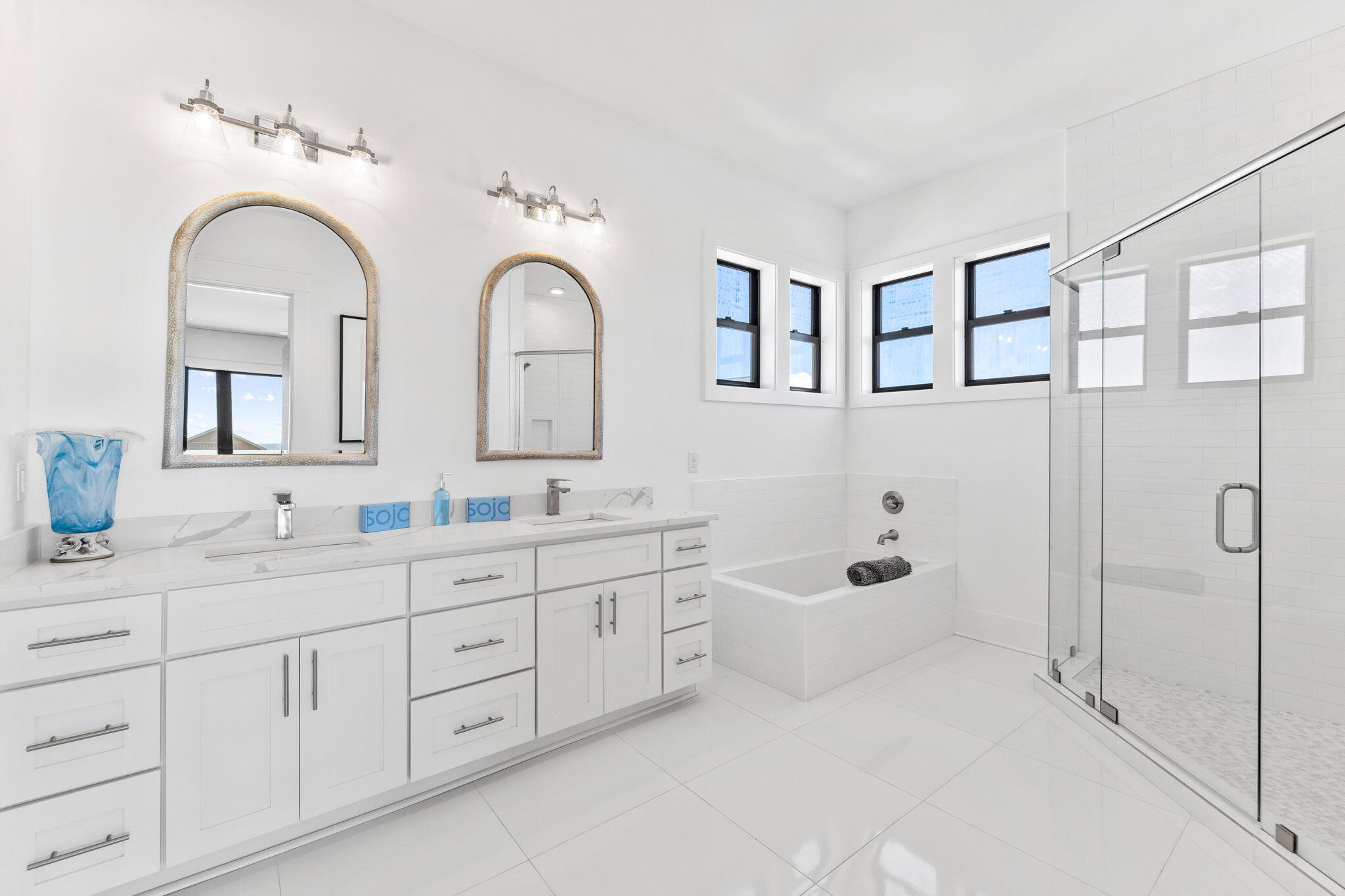 211 Snowdrift Road Miramar Beach, FL 32550 - Photo 16 of 46 a spacious en suite bathroom with double sink a toilet a window and mirror