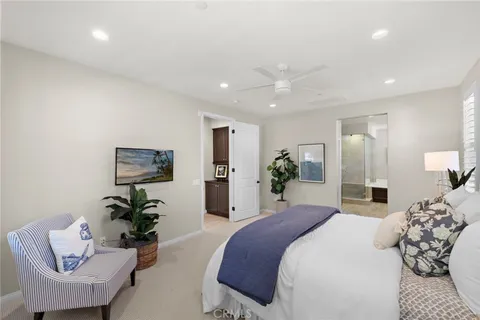 a bedroom with a bed and a couch