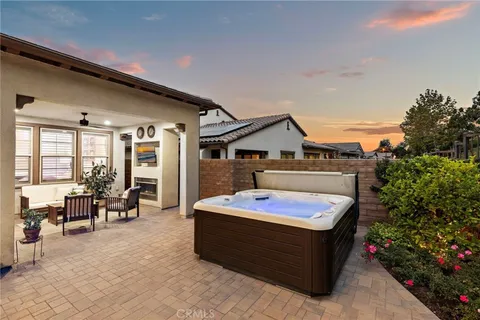 a spacious bathroom with a tub sink and mirror