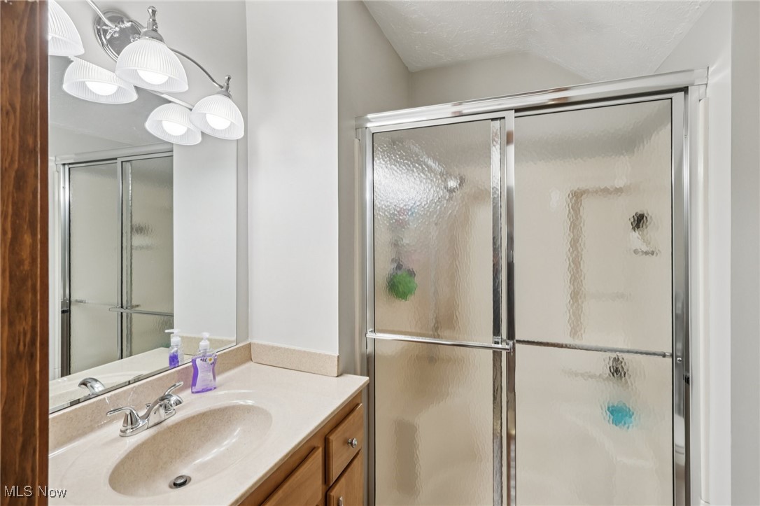 235 Solon Road, Unit D Chagrin Falls, OH 44022 - Photo 25 of 37 Full bathroom with a stall shower, vanity