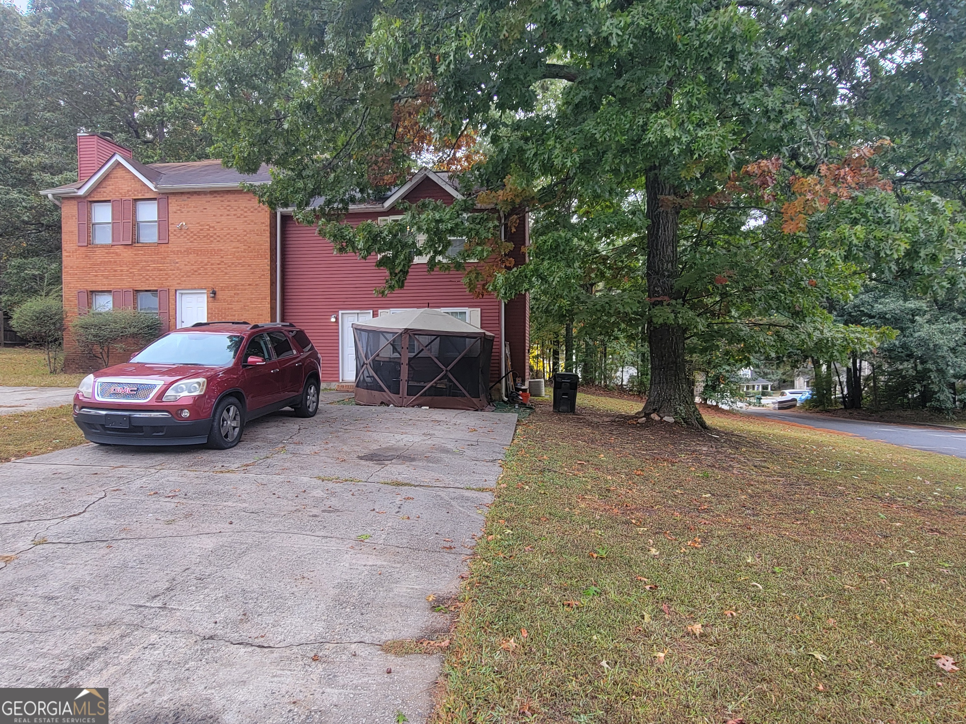 5553-5557 Windwood Road Atlanta, GA 30349 - Photo 2 of 3 a car parked in front of a house