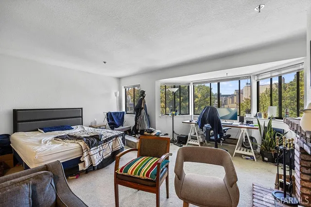 a bathroom with a toilet a sink a mirror a bathtub and vanity