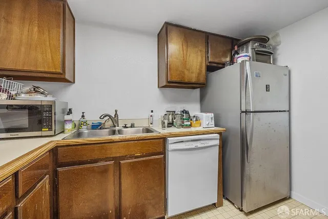 a kitchen with sink cabinets and stove