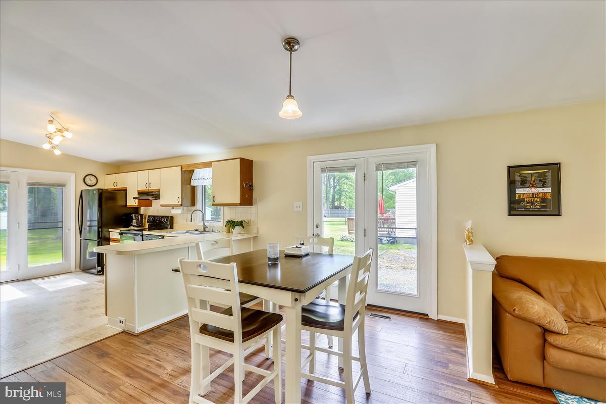 628 Old Love Point Road Stevensville, MD 21666 - Photo 13 of 55 Dining into Kitchen